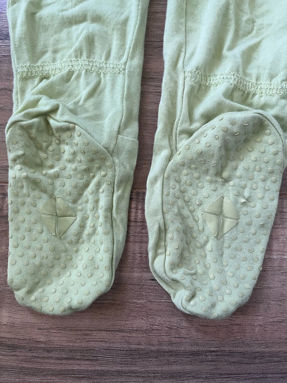 Kyte Baby kiwi footed zip romper